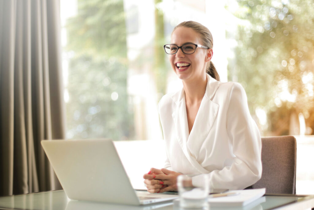 A high-level and confident expert smiles while conducting the private equity due diligence process with a client.